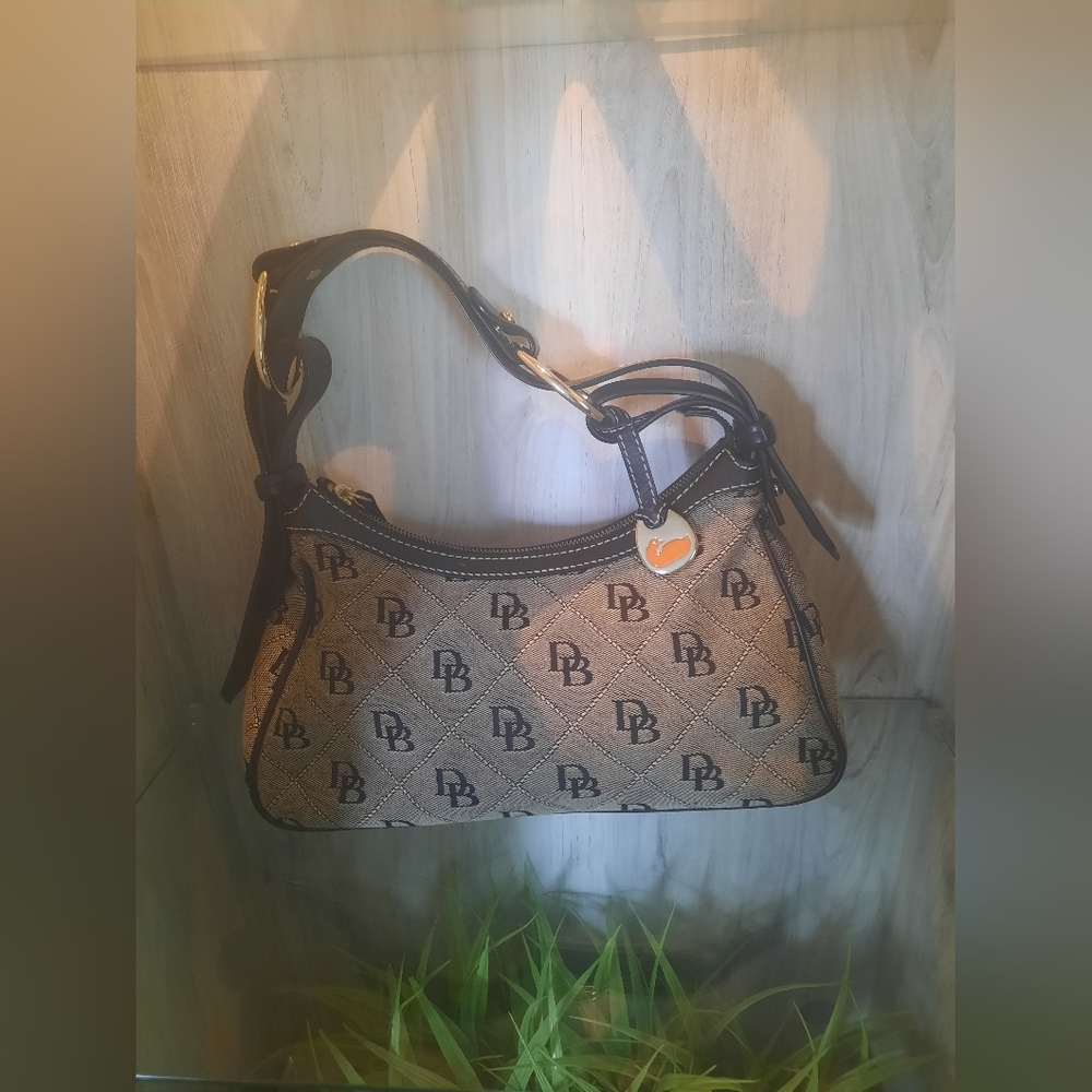 Dooney & Bourke beige & black Signature Canvas and Leather Hobo Bag.
